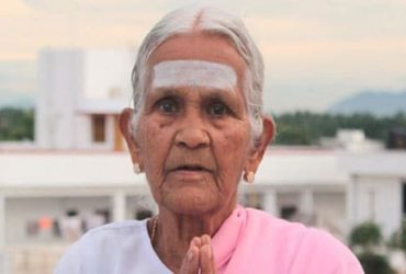 Flexible old yoga teacher V Nanammal from india