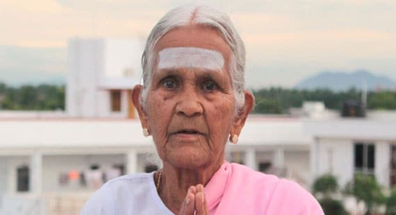 Flexible old yoga teacher V Nanammal from india
