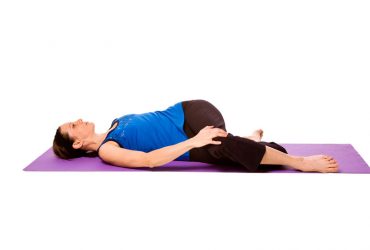 Markatasana spine twist yoga pose